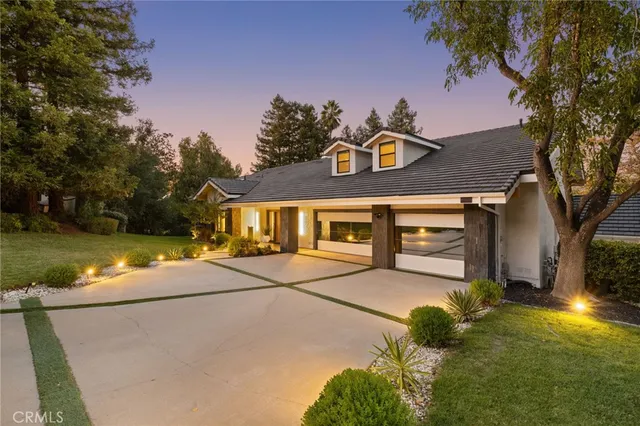 a couple of potted plants in front of door