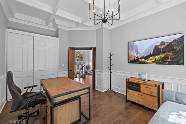 a view of a patio with furniture and floor to ceiling window