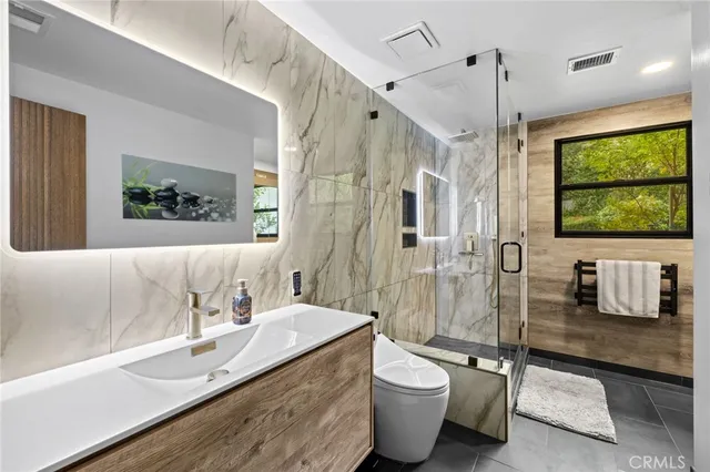 a front view of a house with a yard table and chairs