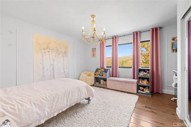 an aerial view of a house with a yard and garden