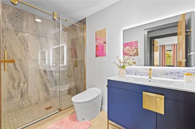 an aerial view of a house with a yard and large trees