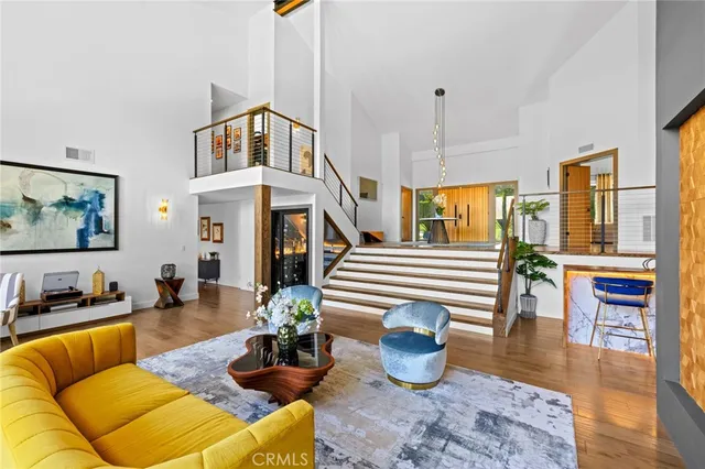 a living room with furniture fireplace and flat screen tv