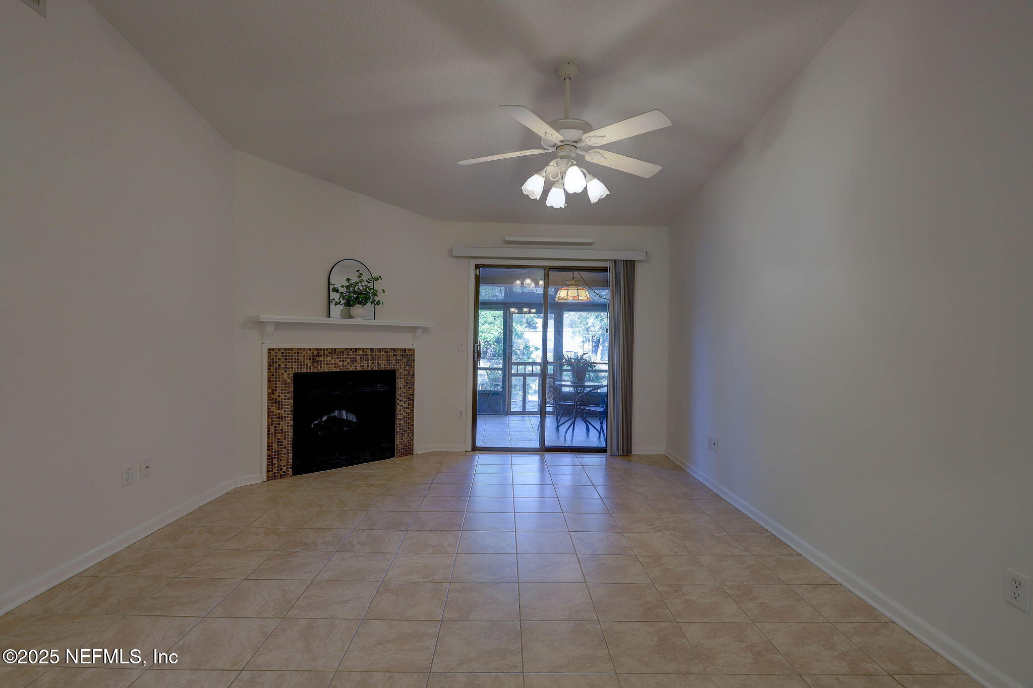 3801 Crown Point Road, Unit 1151 Jacksonville, FL 32257 - Photo 8 of 30 a view of an empty room with a window and fireplace