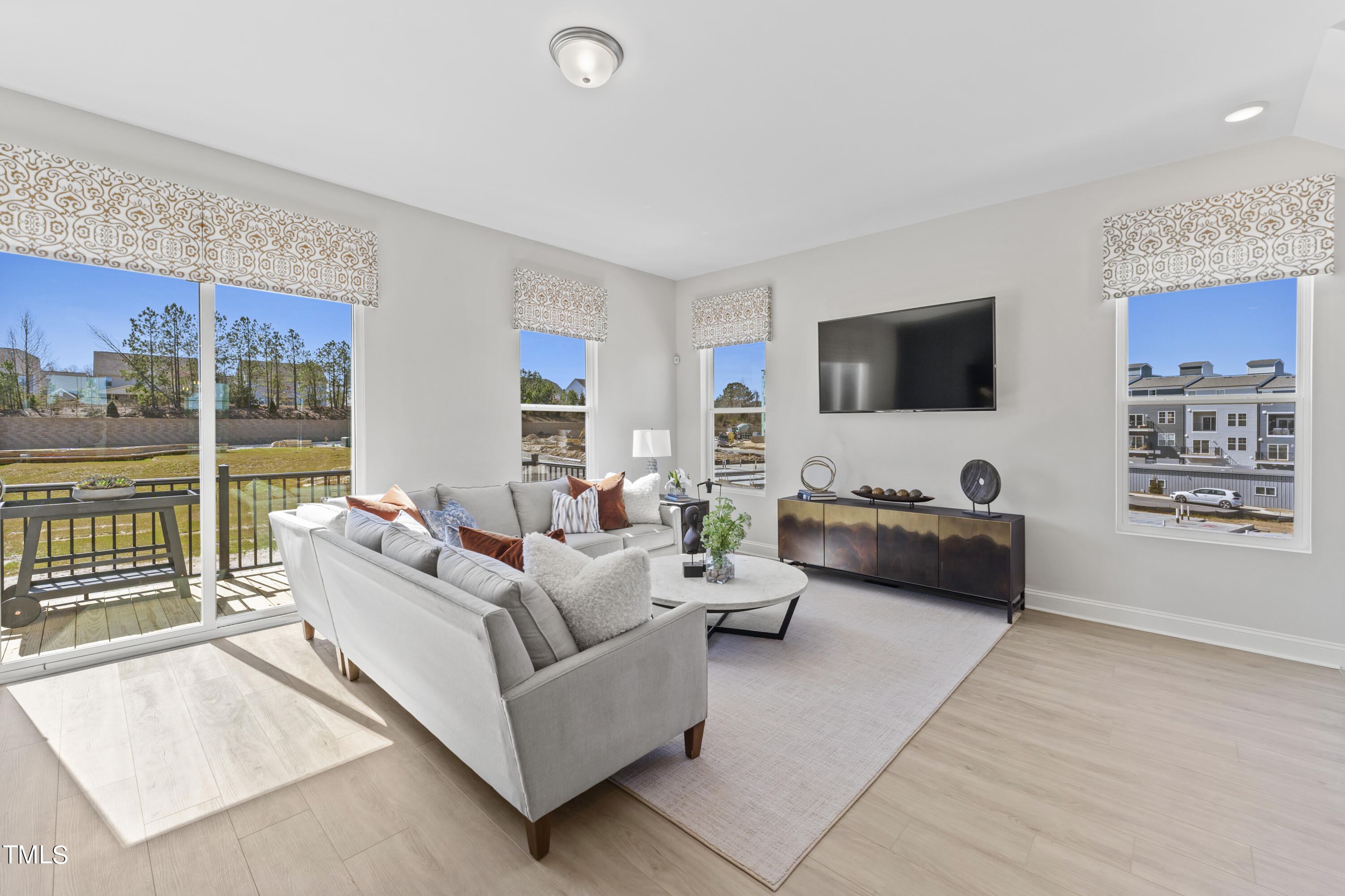 512 Hedrick Ridge Road Cary, NC 27519 - Photo 5 of 19 a living room with furniture and a flat screen tv