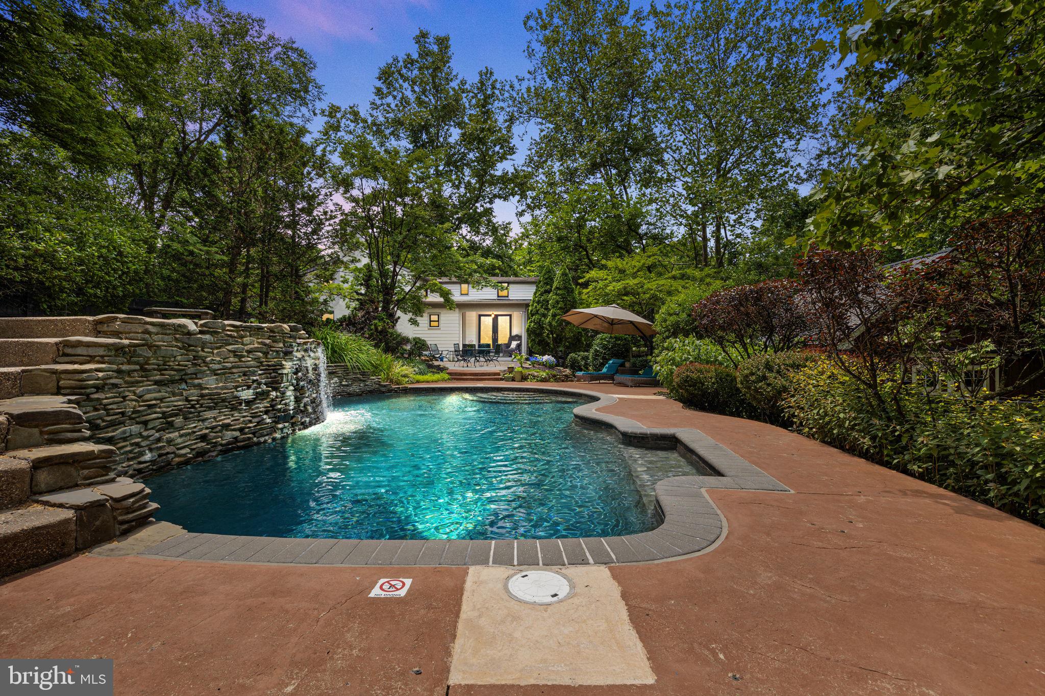 View of the house from the pool and waterfall