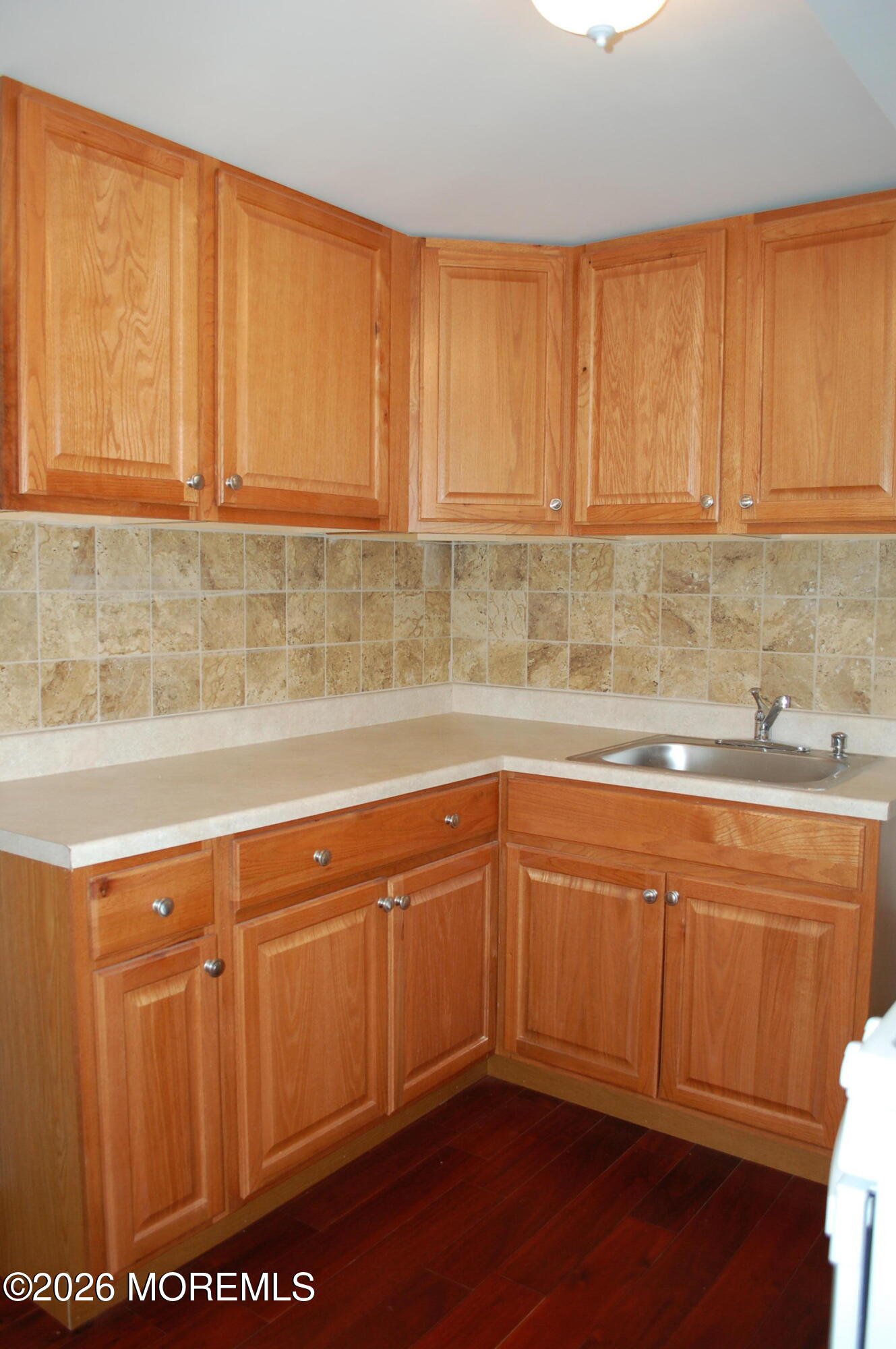 107 Broad Street, Unit B Matawan, NJ 07747 - Photo 2 of 10 a kitchen with stainless steel appliances granite countertop a sink and cabinets