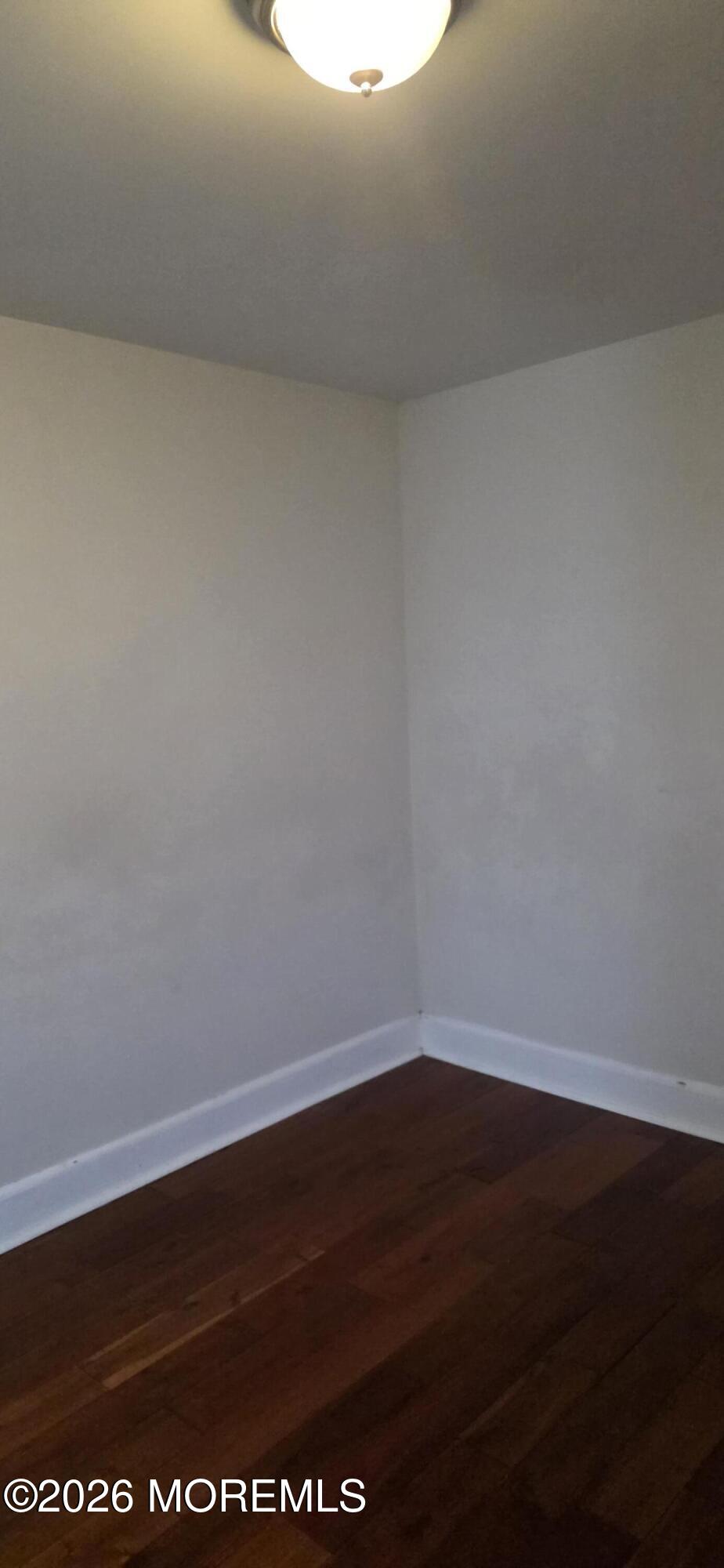 107 Broad Street, Unit B Matawan, NJ 07747 - Photo 2 of 10 a view of room with wooden floor