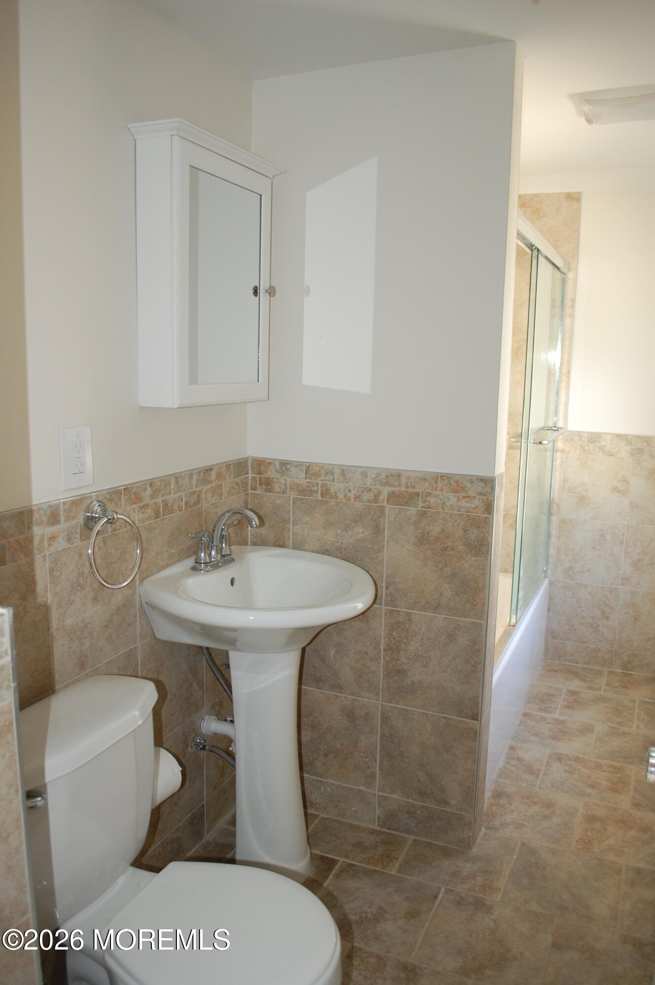 107 Broad Street, Unit B Matawan, NJ 07747 - Photo 3 of 10 a bathroom with a sink toilet and shower