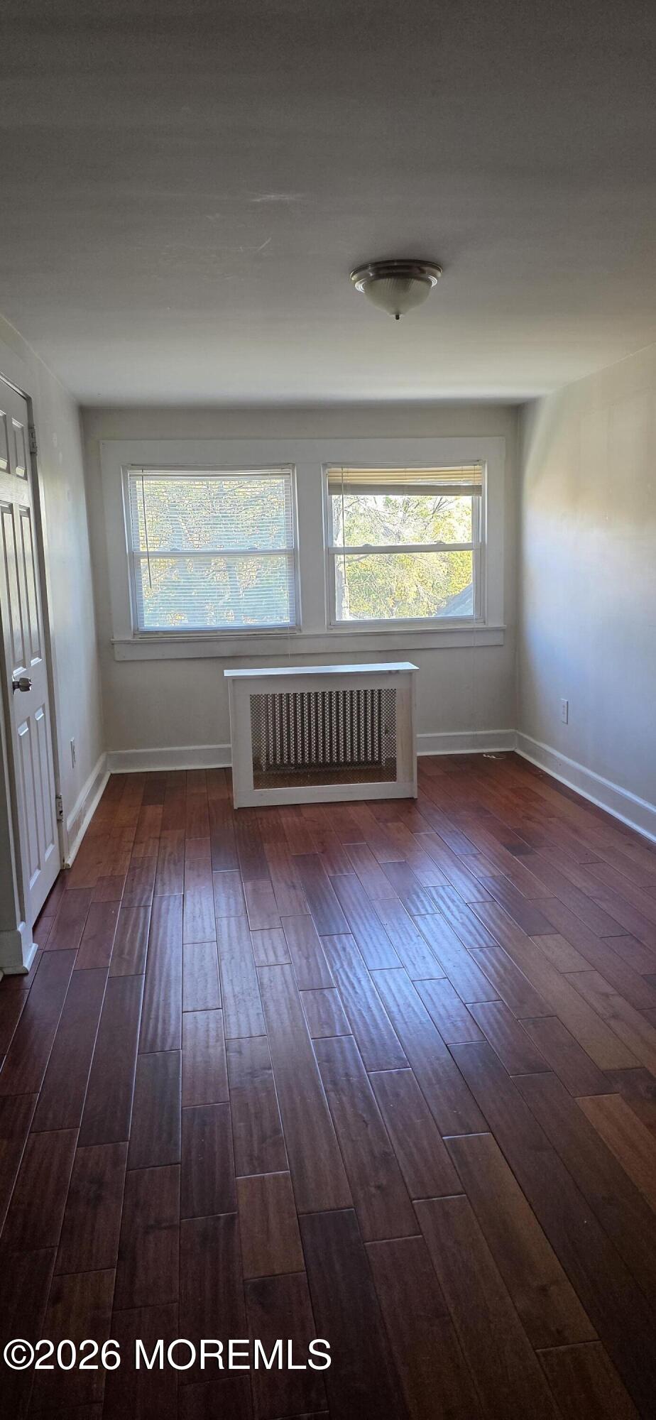 107 Broad Street, Unit B Matawan, NJ 07747 - Photo 3 of 10 wooden floor in an empty room with a window