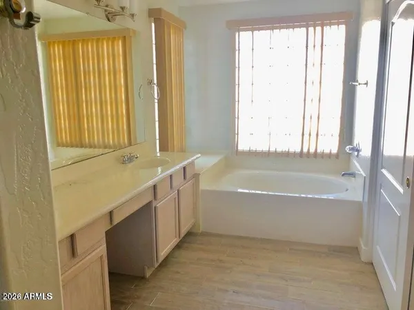 a bathroom with a sink toilet a mirror and shower