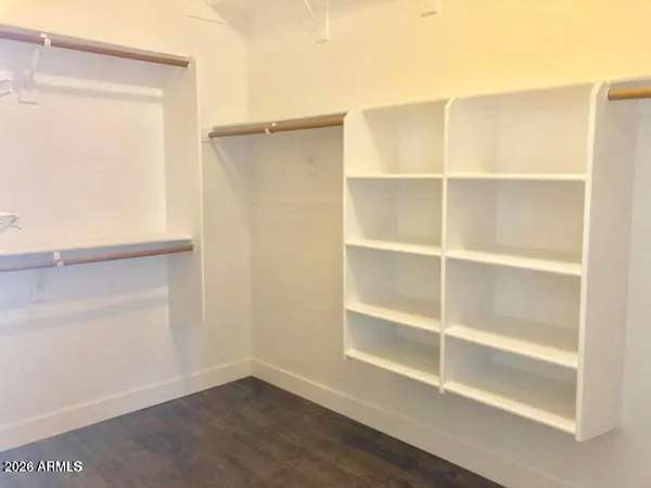 a view of wooden floor in an empty room