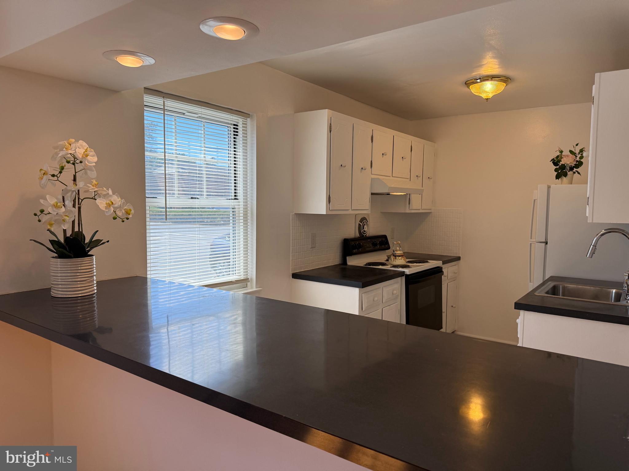 121 The Orchards, Unit I Cranbury, NJ 08512 - Photo 11 of 26 a kitchen with counter top space cabinets and appliances