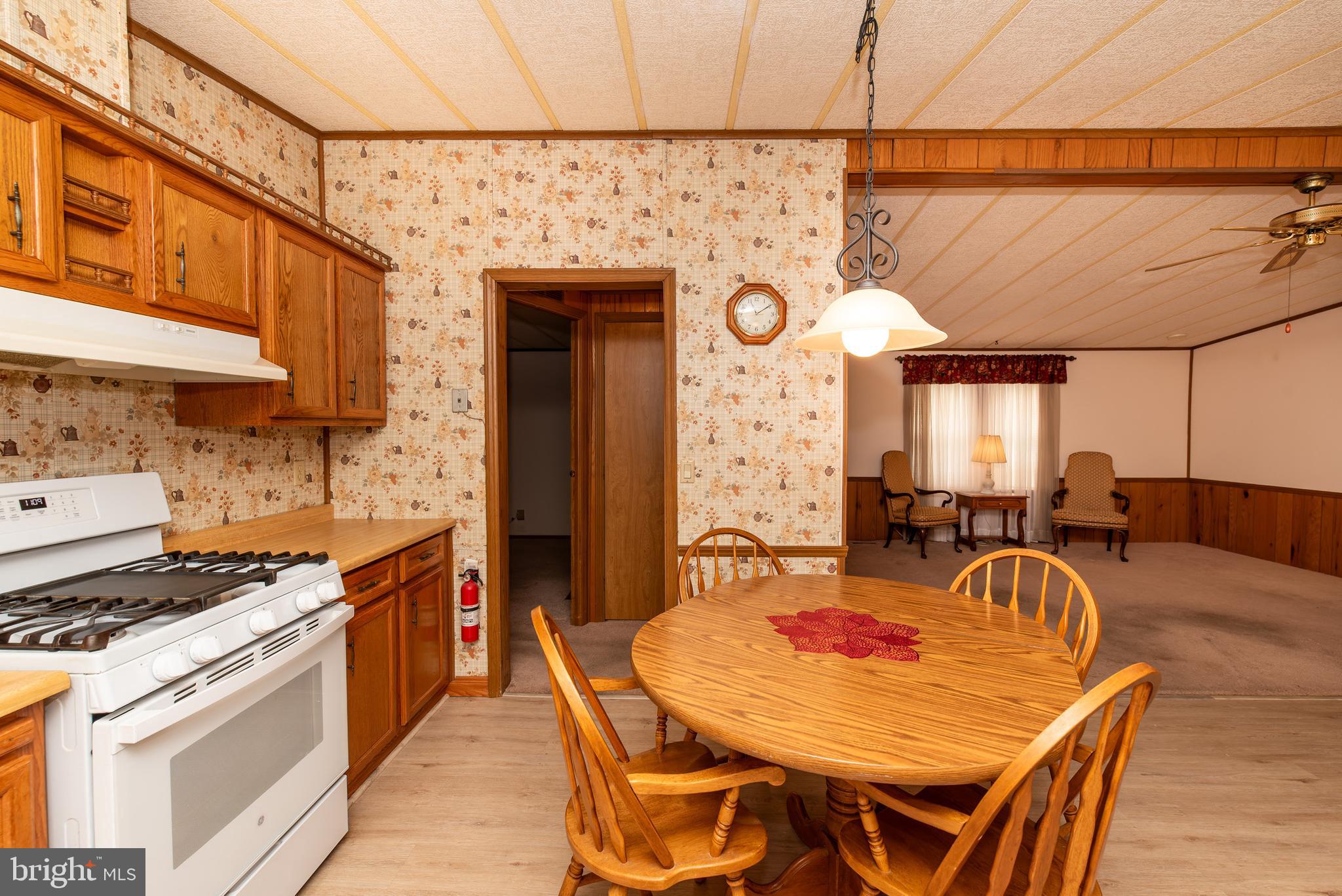 453 Priscilla Lane Buena, NJ 08310 - Photo 14 of 52 a view of a dining table and chairs in a kitchen