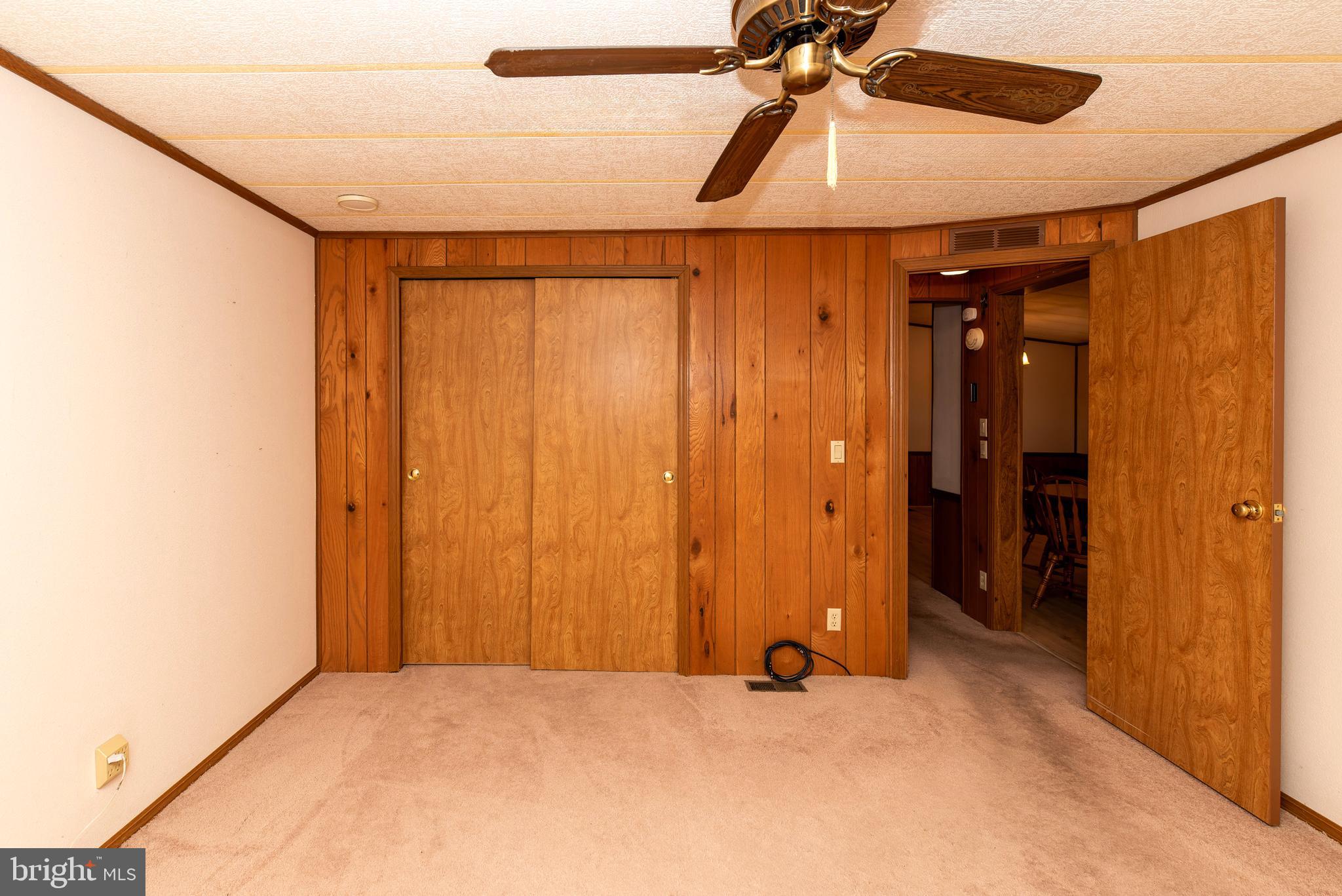 453 Priscilla Lane Buena, NJ 08310 - Photo 24 of 52 an empty room with closet and a chandelier fan