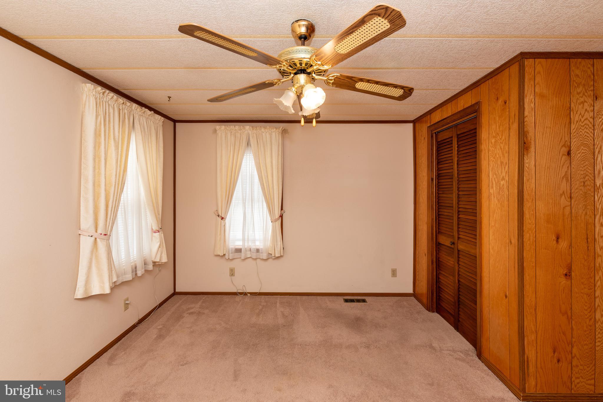453 Priscilla Lane Buena, NJ 08310 - Photo 28 of 52 an empty room with windows and fan