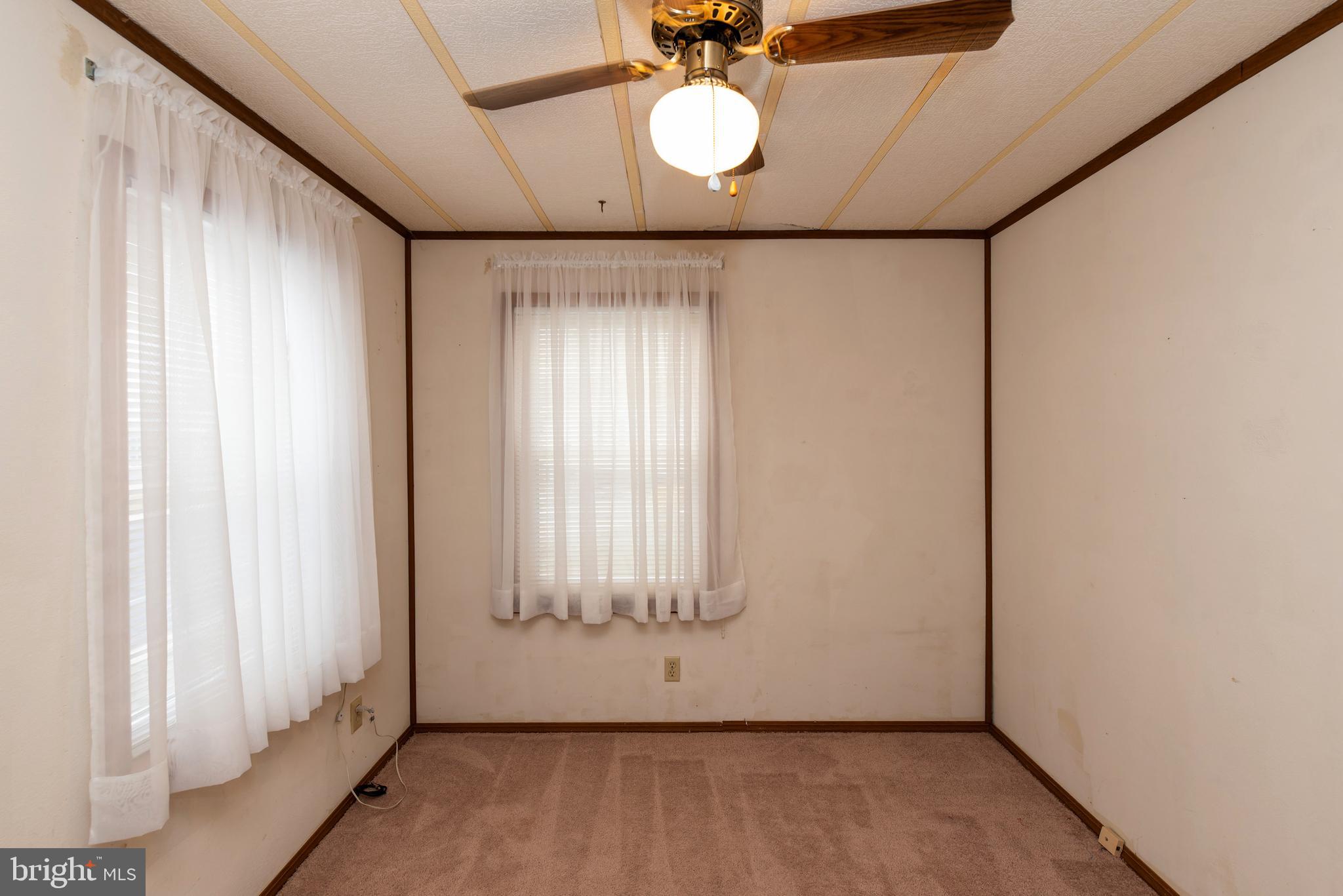 453 Priscilla Lane Buena, NJ 08310 - Photo 31 of 52 a view of a garage with wooden floor and a window