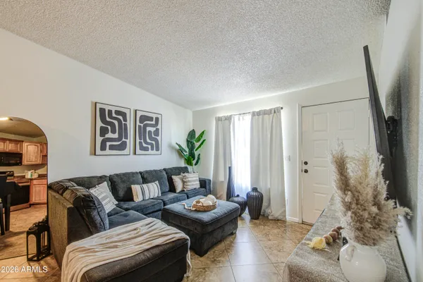 a living room with furniture and a flat screen tv