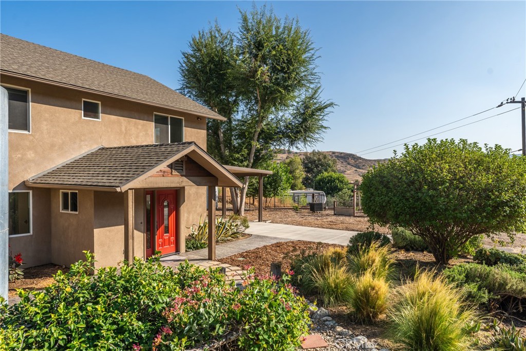 30300 Live Oak Canyon Road Redlands, CA 92373 - Photo 14 of 67 a front view of a house with a yard