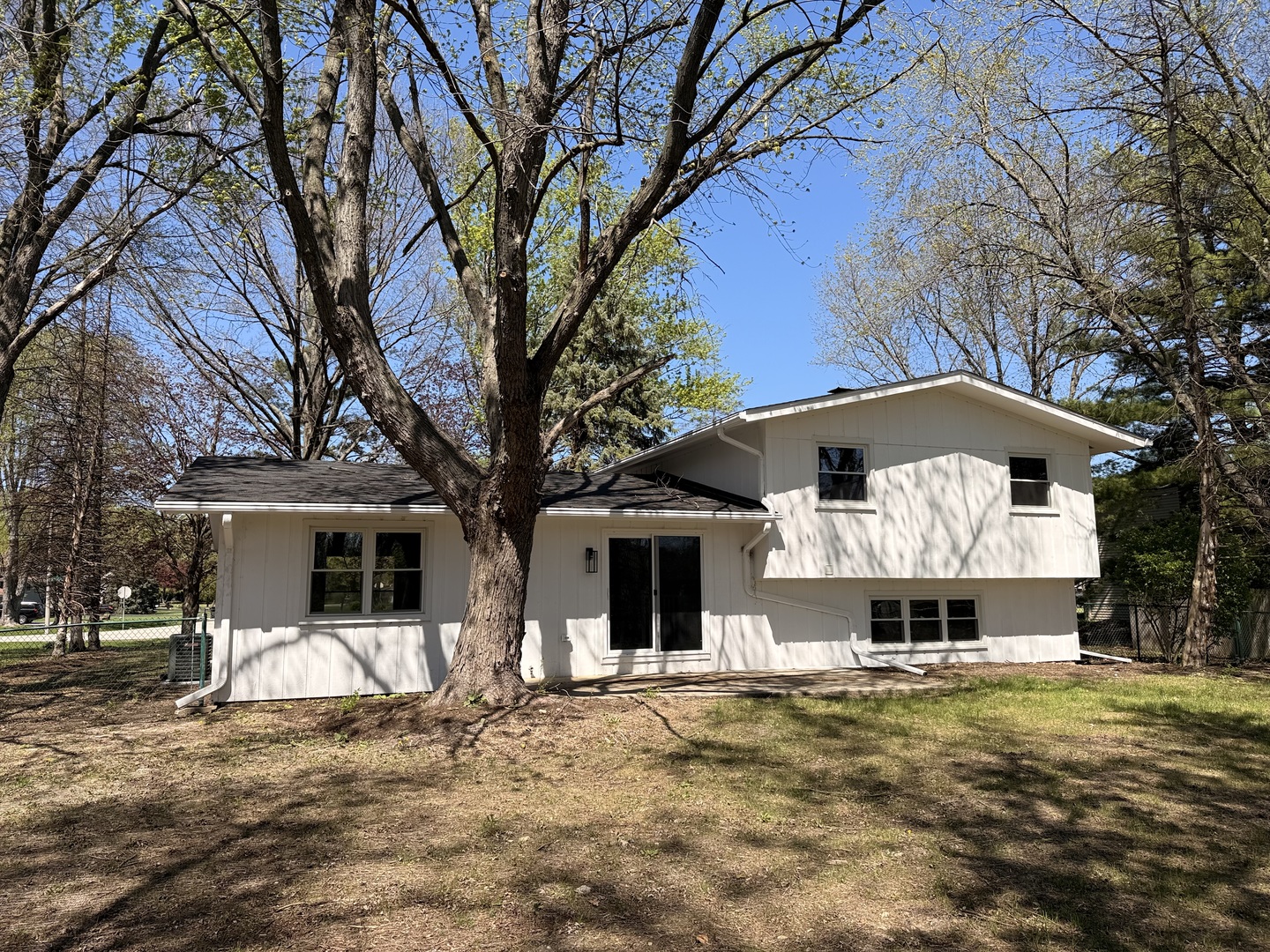 28W555 Leverenz Road Naperville, IL 60564 - Photo 3 of 24 a front view of a house with a yard and large tree