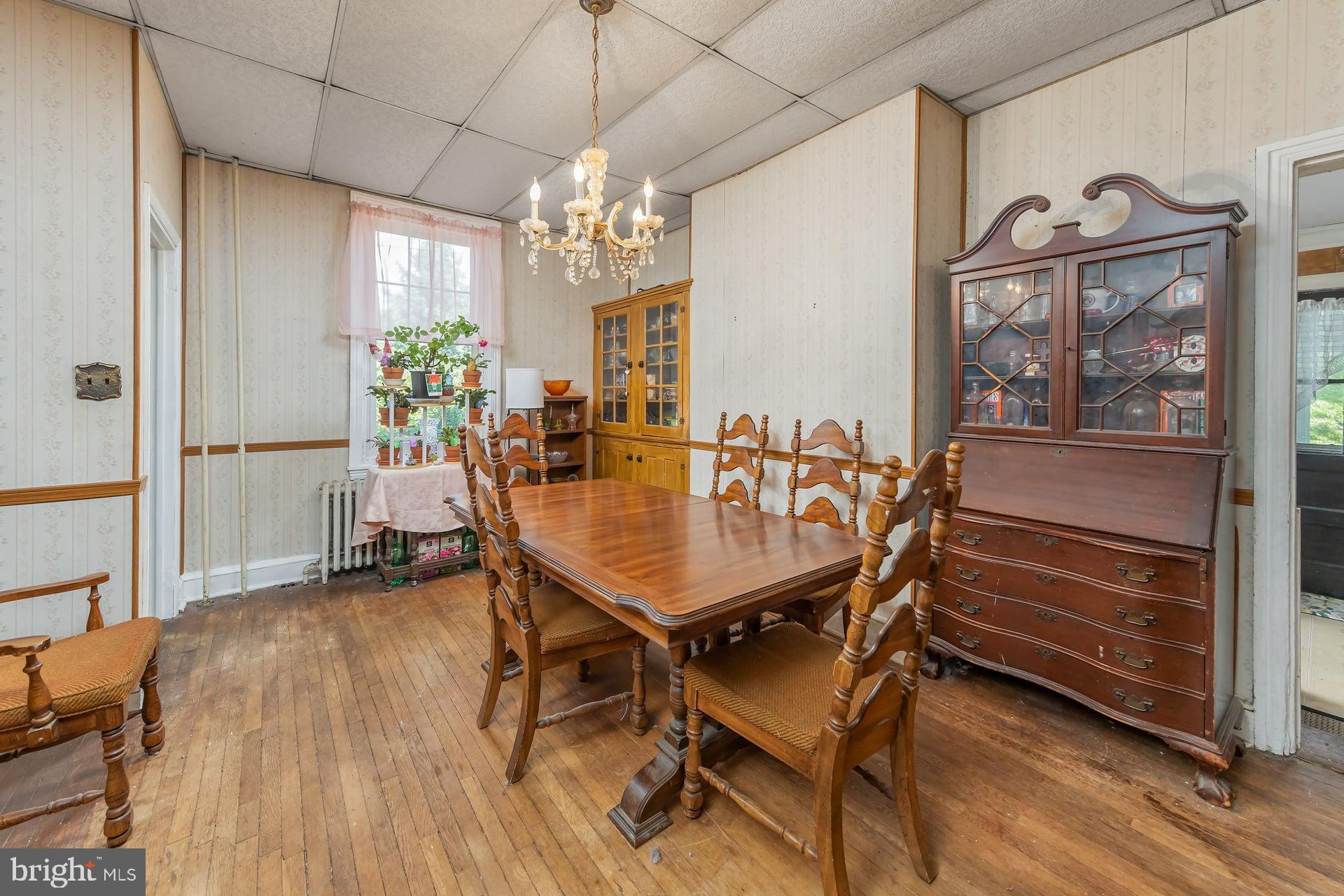 401 West Avenue Delanco, NJ 08075 - Photo 4 of 19 a dining room with furniture a chandelier and wooden floor