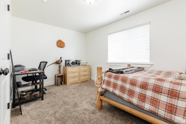 1145 West 2640th Street South Logan, UT 84321 - Photo 9 of 17 Spacious room featuring neutral carpeting and white walls