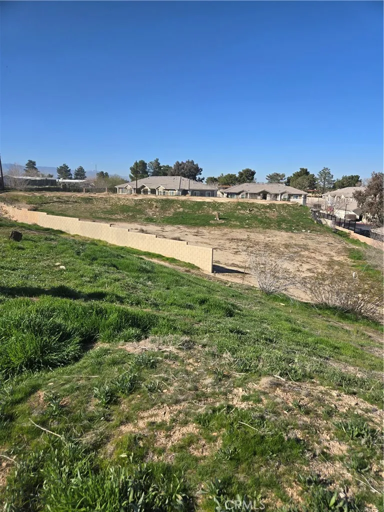 14140 Rodeo Drive Victorville, CA 92395 - Photo 4 of 11 a view of a lake with houses in the back