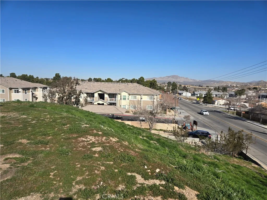14140 Rodeo Drive Victorville, CA 92395 - Photo 6 of 11 a view of a house with a big yard