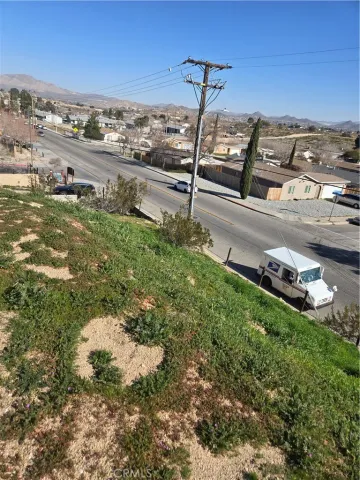 a view of a street with sitting area