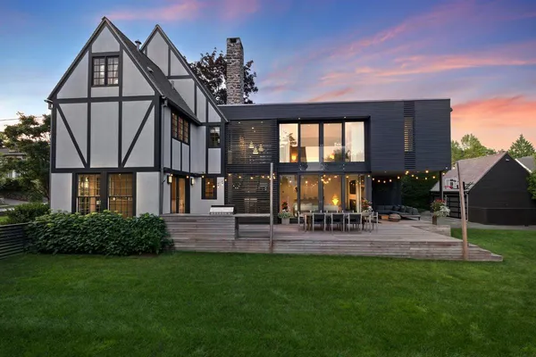 a view of a house with a backyard and a patio