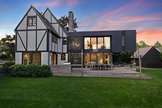 a view of a house with a backyard and a patio