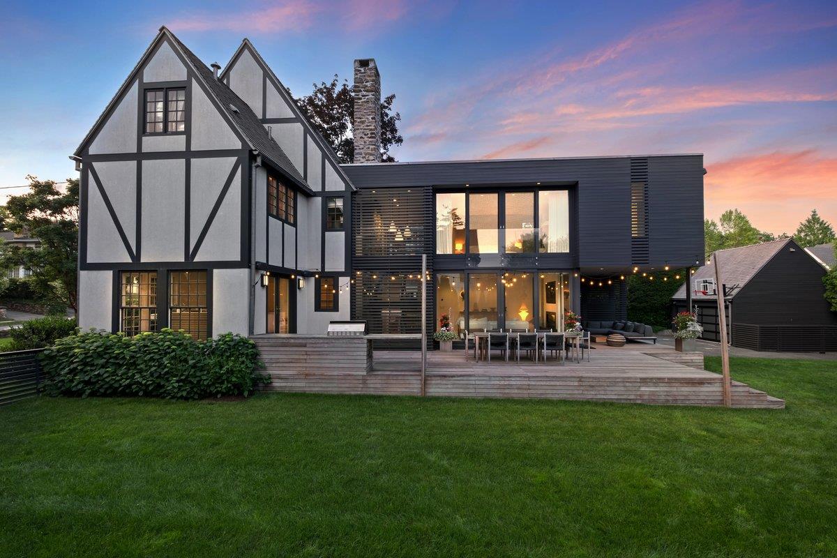 a view of a house with a backyard and a patio