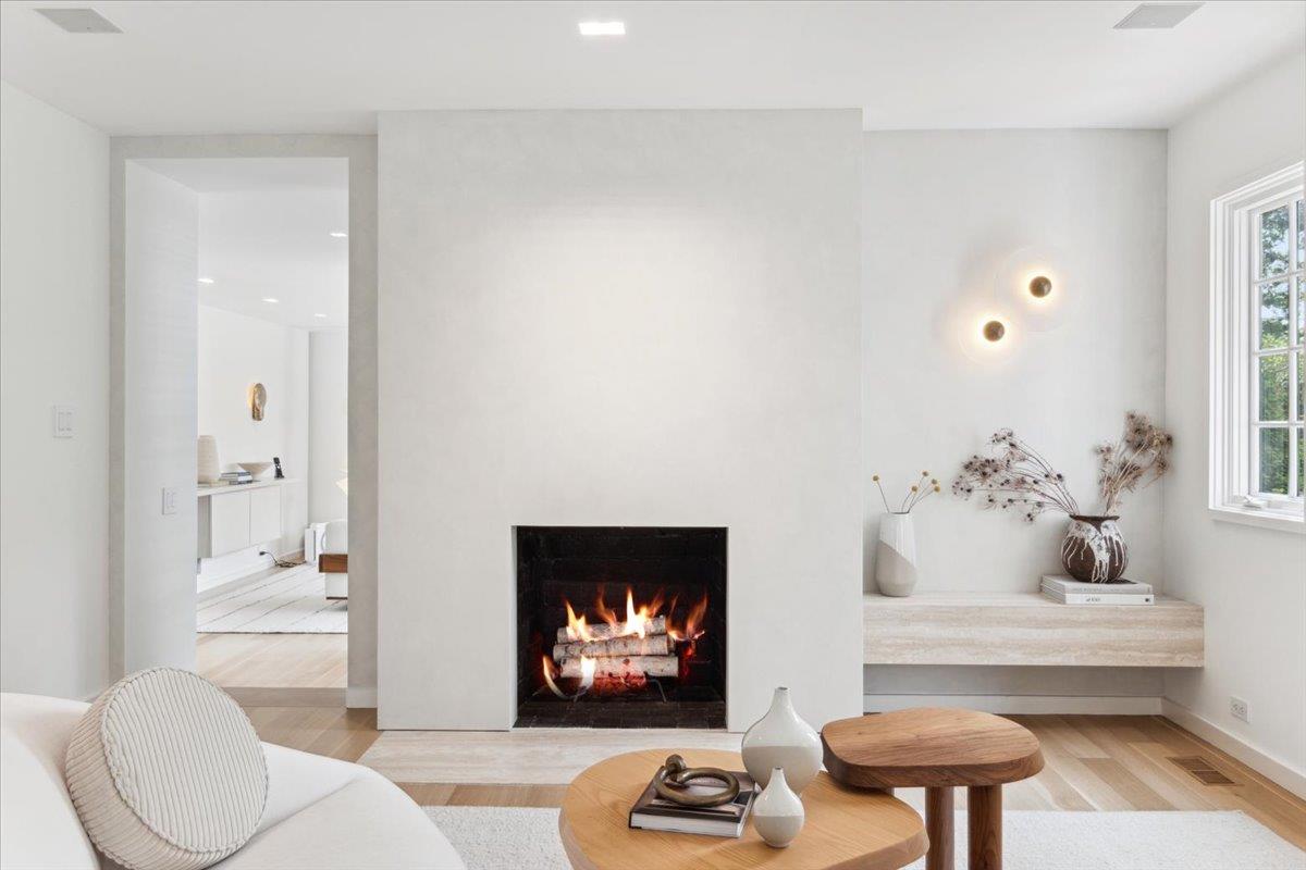 35 Halsted Place Rye, NY 10580 - Photo 11 of 41 a living room with furniture and a fireplace