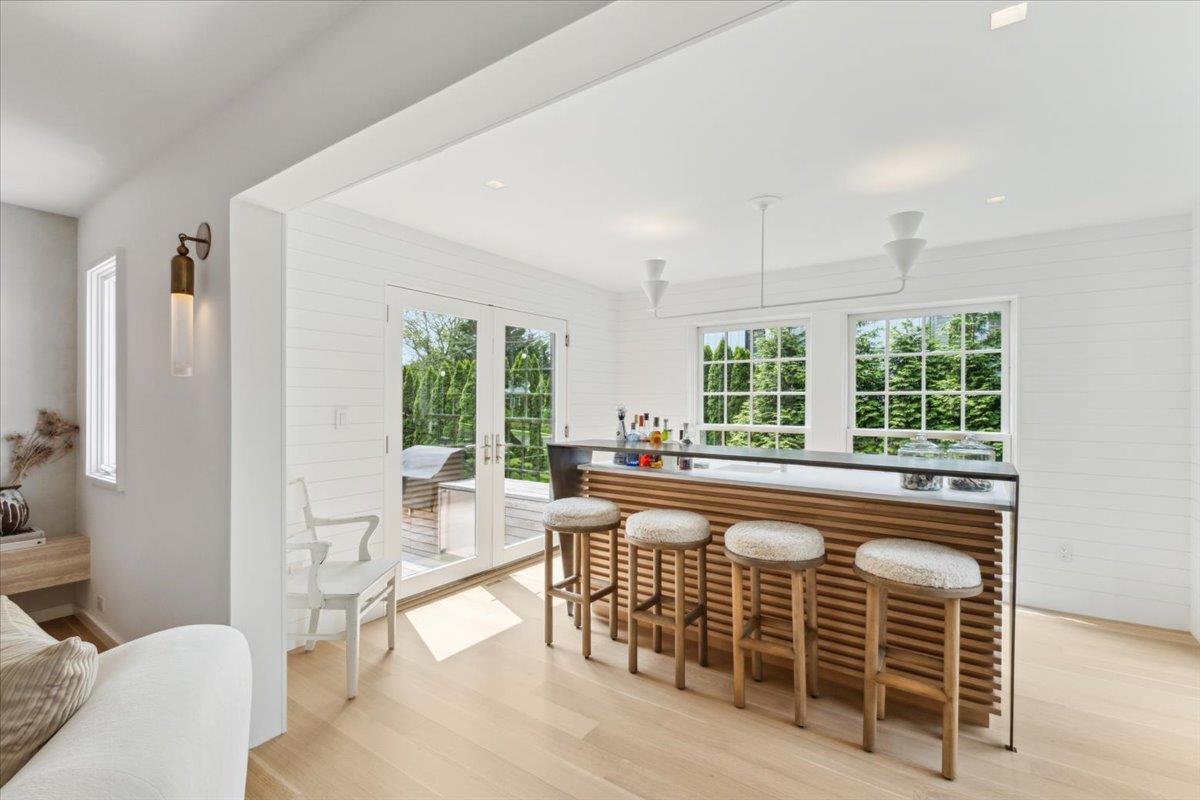 35 Halsted Place Rye, NY 10580 - Photo 12 of 41 a living room with furniture a large window and kitchen view