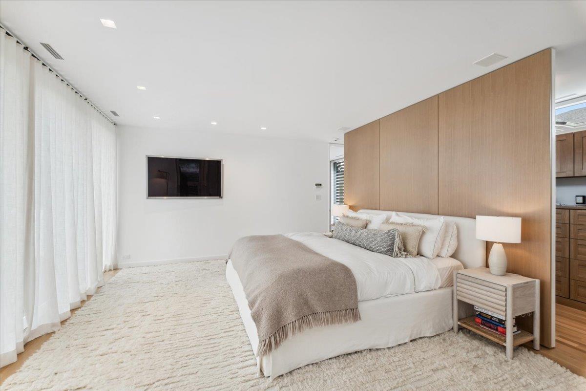 35 Halsted Place Rye, NY 10580 - Photo 18 of 41 a bedroom with a bed and a flat screen tv