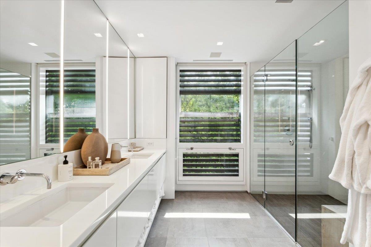 35 Halsted Place Rye, NY 10580 - Photo 19 of 41 a bathroom with a tub sink and glass door