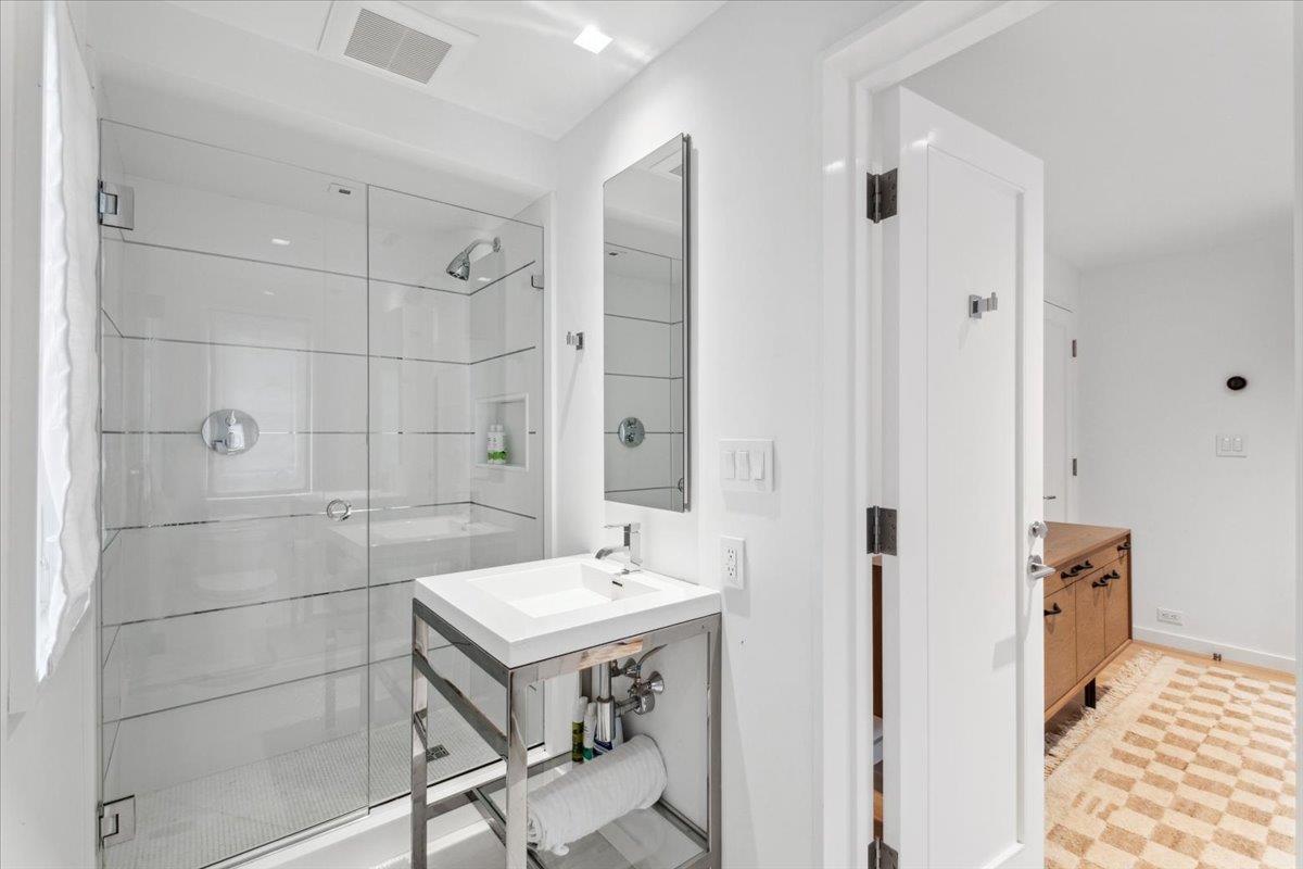 35 Halsted Place Rye, NY 10580 - Photo 24 of 41 a bathroom with a sink mirror and a shower