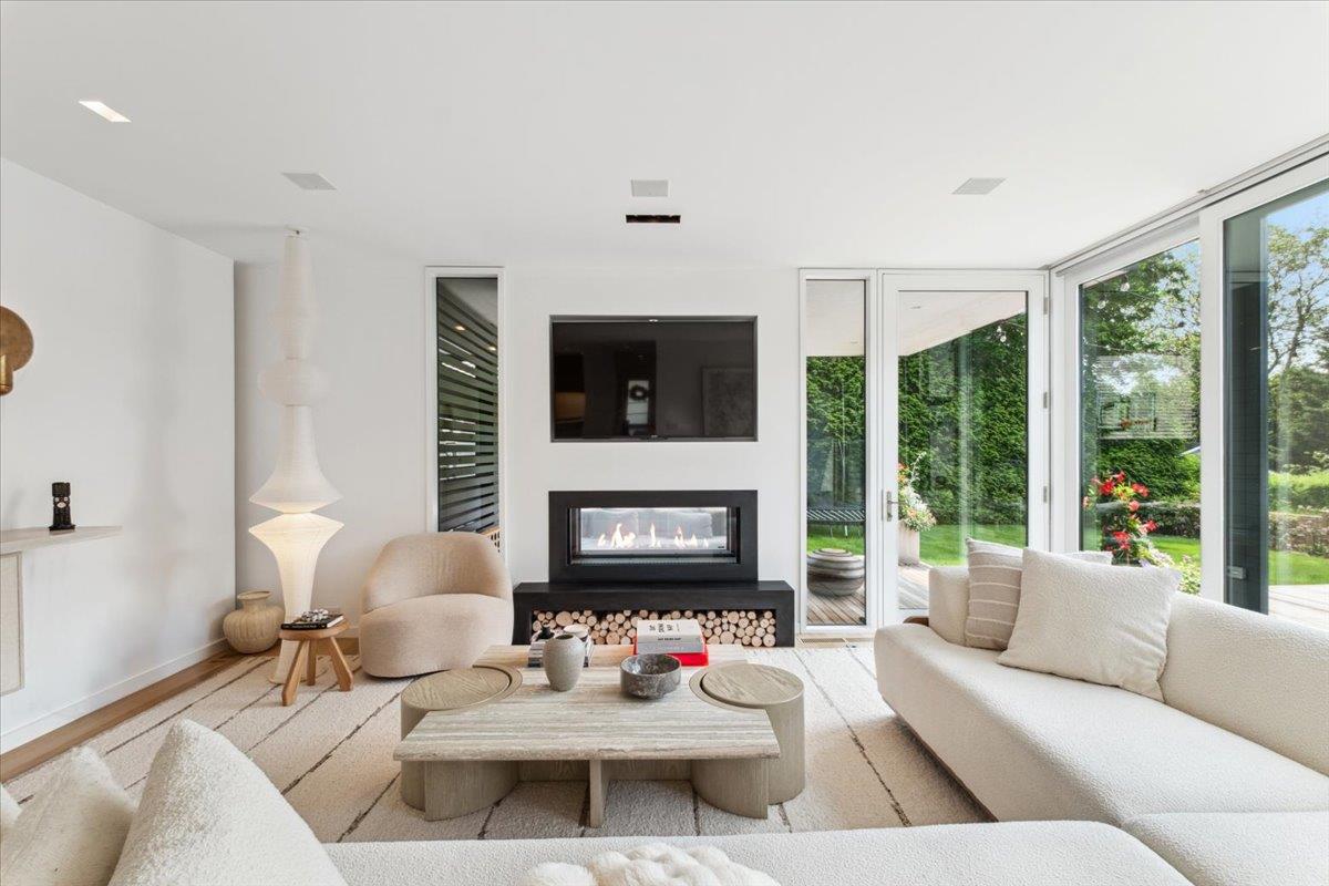 35 Halsted Place Rye, NY 10580 - Photo 4 of 41 a living room with furniture fireplace and a large window