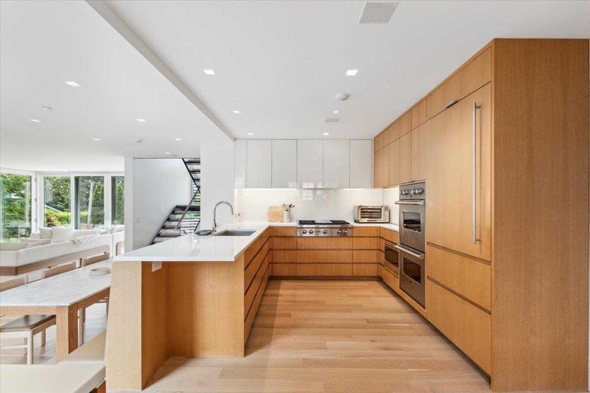 35 Halsted Place Rye, NY 10580 - Photo 7 of 41 a large kitchen with stainless steel appliances granite countertop a sink and cabinets