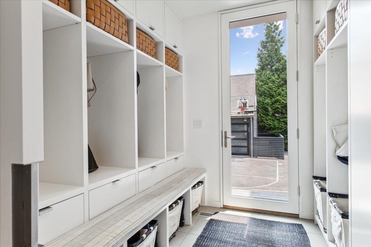 35 Halsted Place Rye, NY 10580 - Photo 9 of 41 a bathroom with a double vanity sink and a mirror