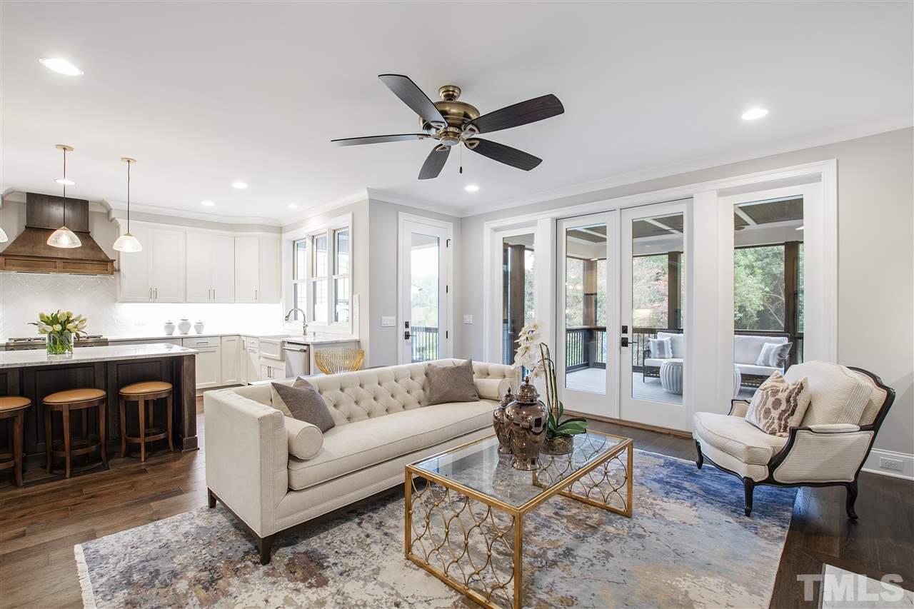 3019 Lewis Farm Road Raleigh, NC 27607 - Photo 11 of 30 a living room with furniture kitchen view and a large window