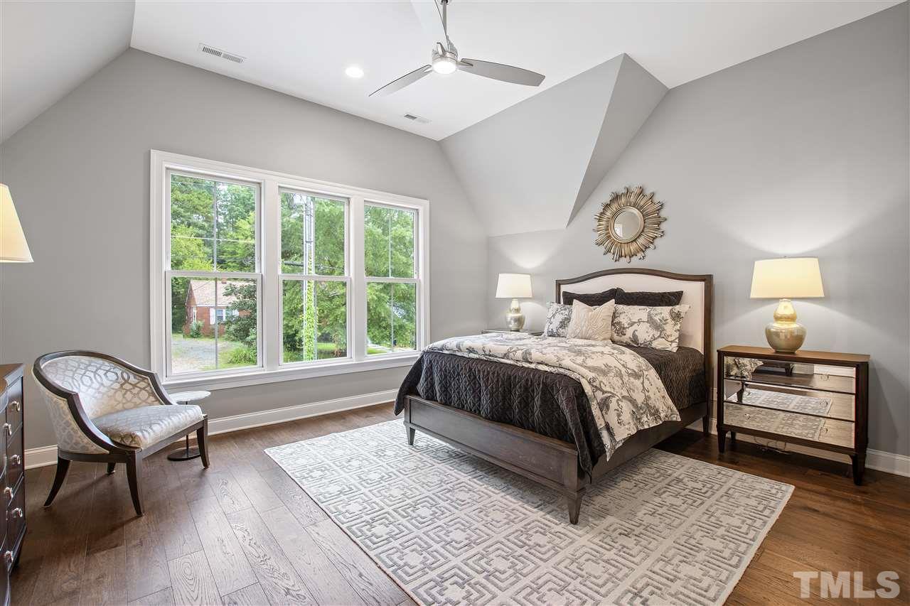 3019 Lewis Farm Road Raleigh, NC 27607 - Photo 18 of 30 a bedroom with a bed and a window