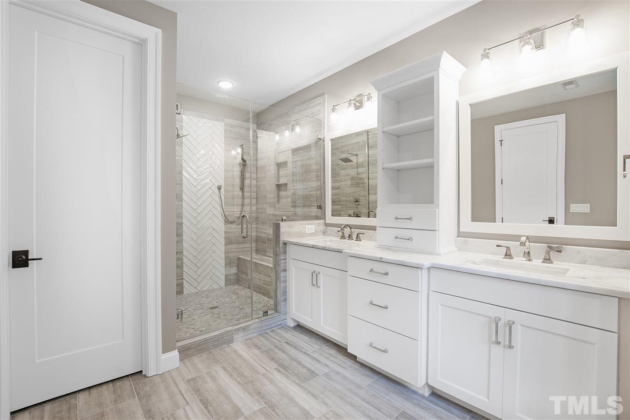 3019 Lewis Farm Road Raleigh, NC 27607 - Photo 20 of 30 a bathroom with a double vanity sink mirror and shower