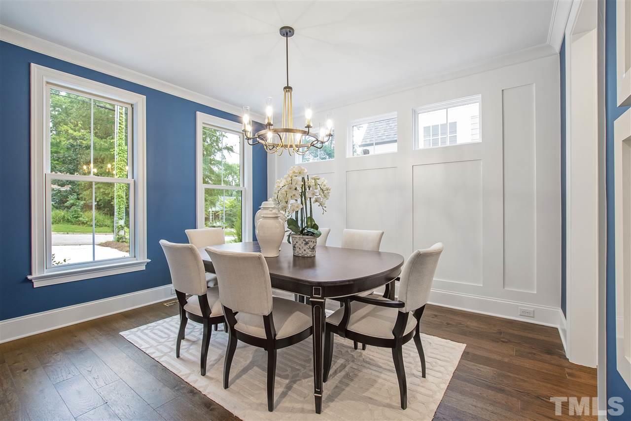 3019 Lewis Farm Road Raleigh, NC 27607 - Photo 3 of 30 a view of a dining room with furniture wooden floor and chandelier
