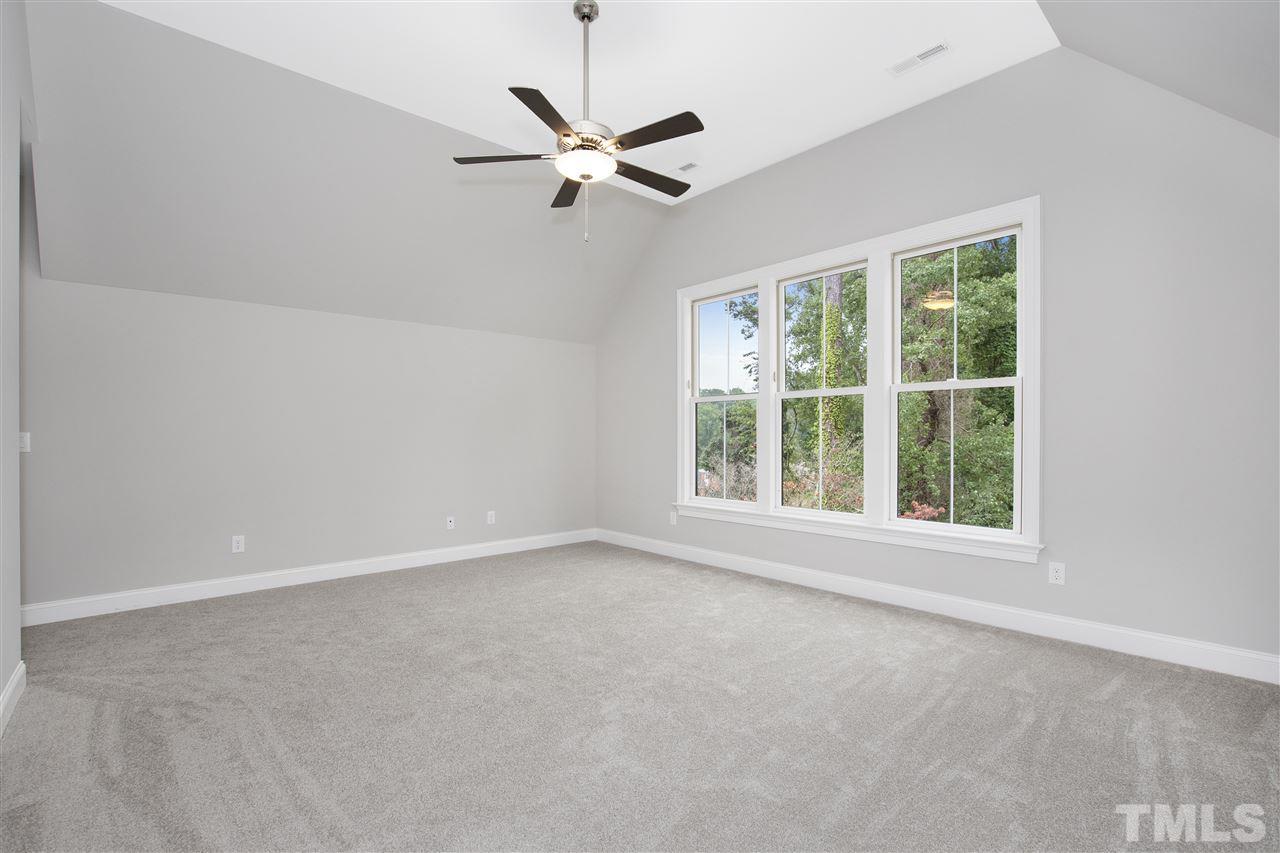 3019 Lewis Farm Road Raleigh, NC 27607 - Photo 26 of 30 an empty room with a window and a fan