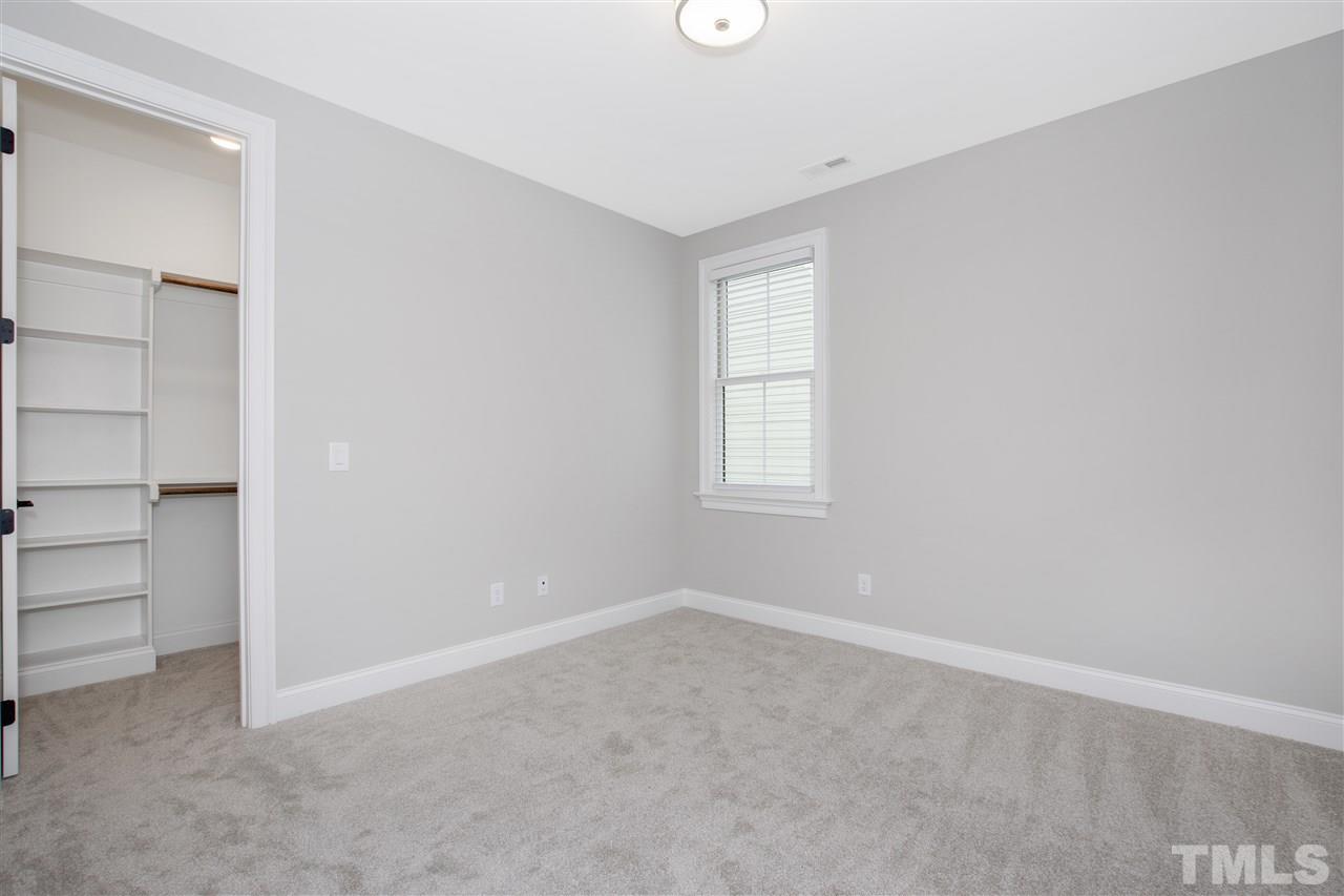 3019 Lewis Farm Road Raleigh, NC 27607 - Photo 28 of 30 an empty room with closet and windows