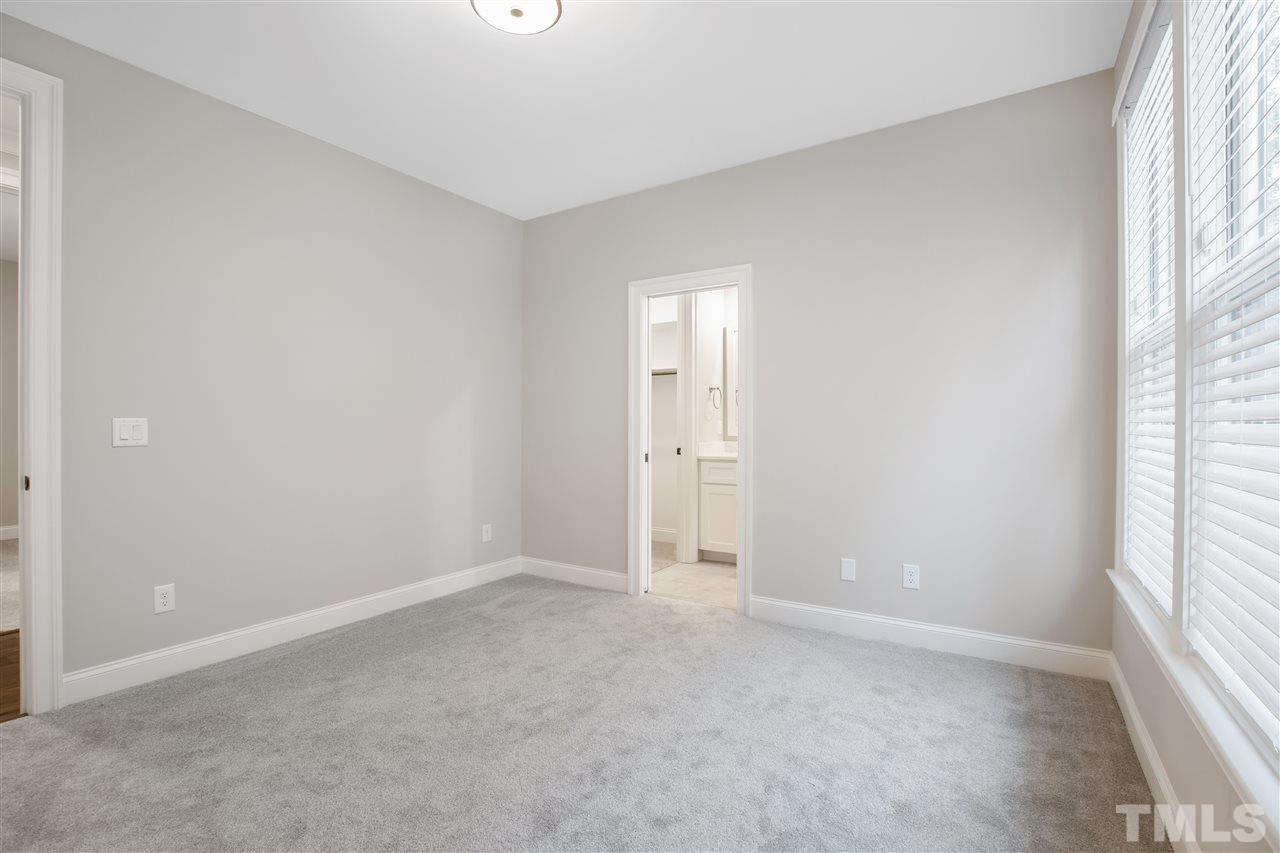 3019 Lewis Farm Road Raleigh, NC 27607 - Photo 29 of 30 an empty room with windows and closet