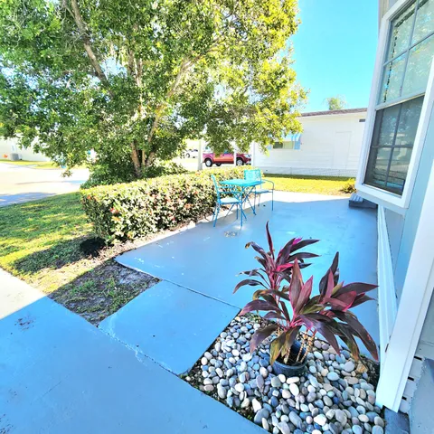 a spacious bedroom with a bed and a large window