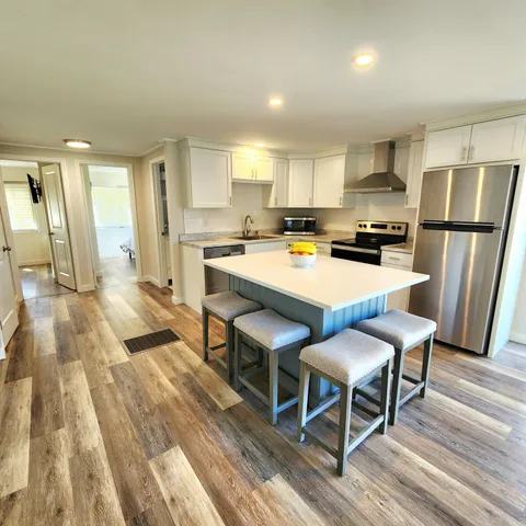 a view of a dining room with furniture and window