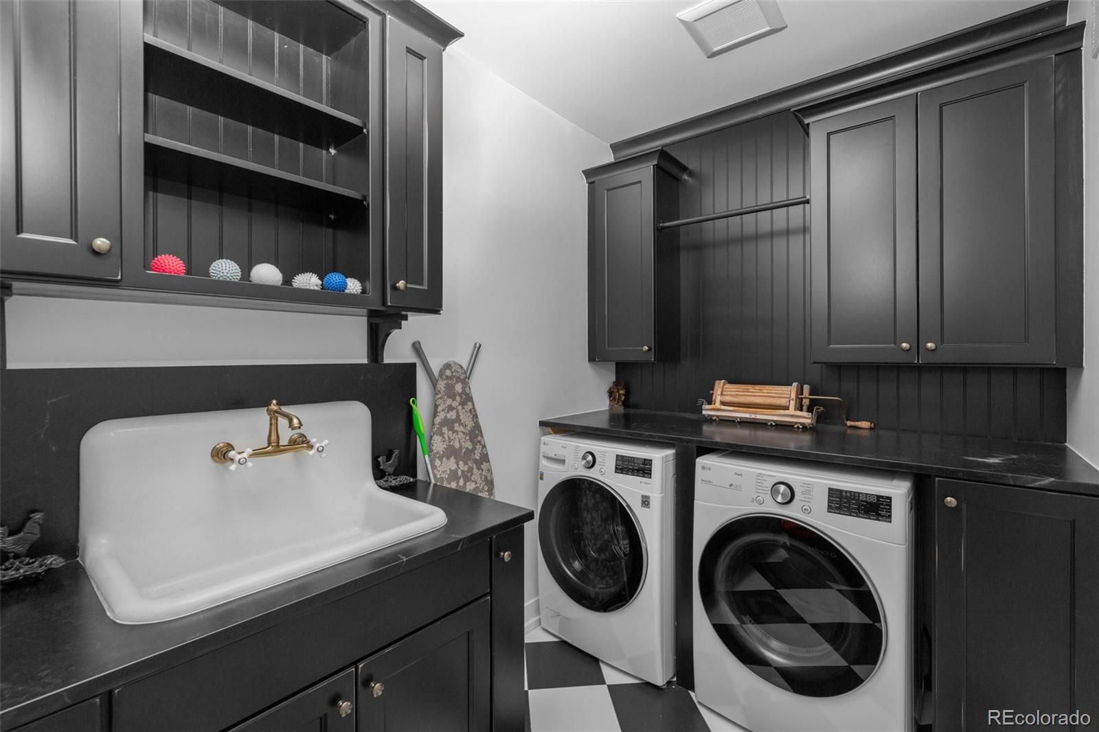 2073 South Perry Park Road Sedalia, CO 80135 - Photo 12 of 40 a utility room with sink dryer and washer
