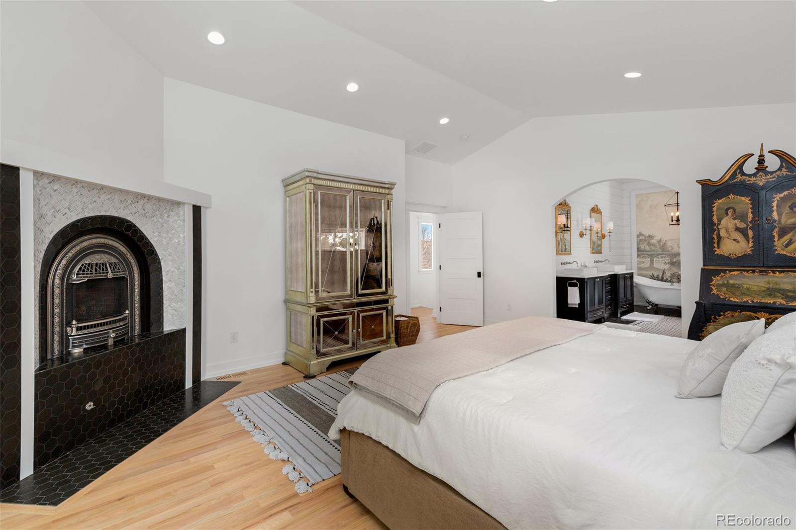 2073 South Perry Park Road Sedalia, CO 80135 - Photo 16 of 40 a bedroom with a bed and a dresser